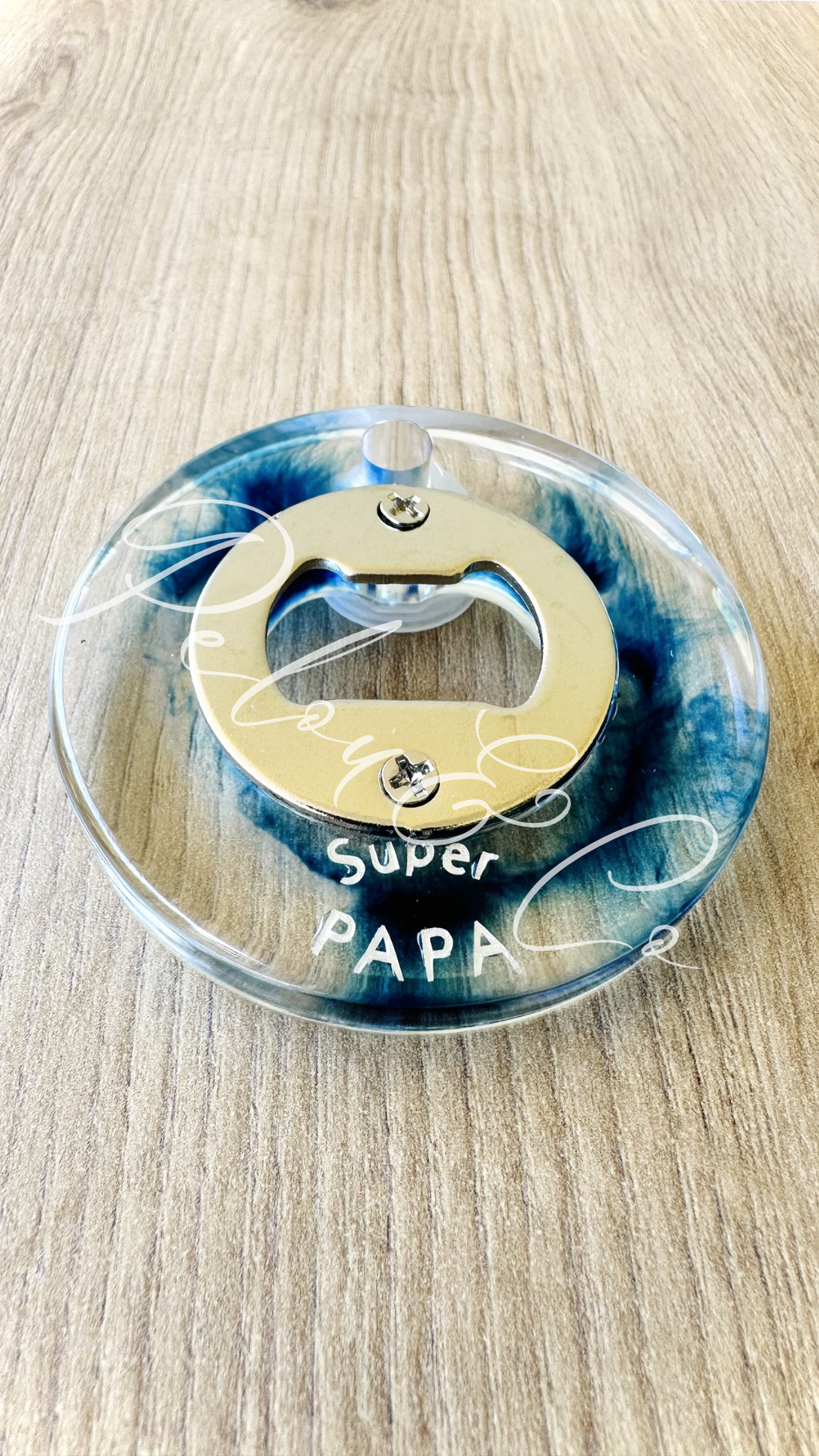 Décapsuleur rond en résine bleu effet voluptés inscription Super Papa.